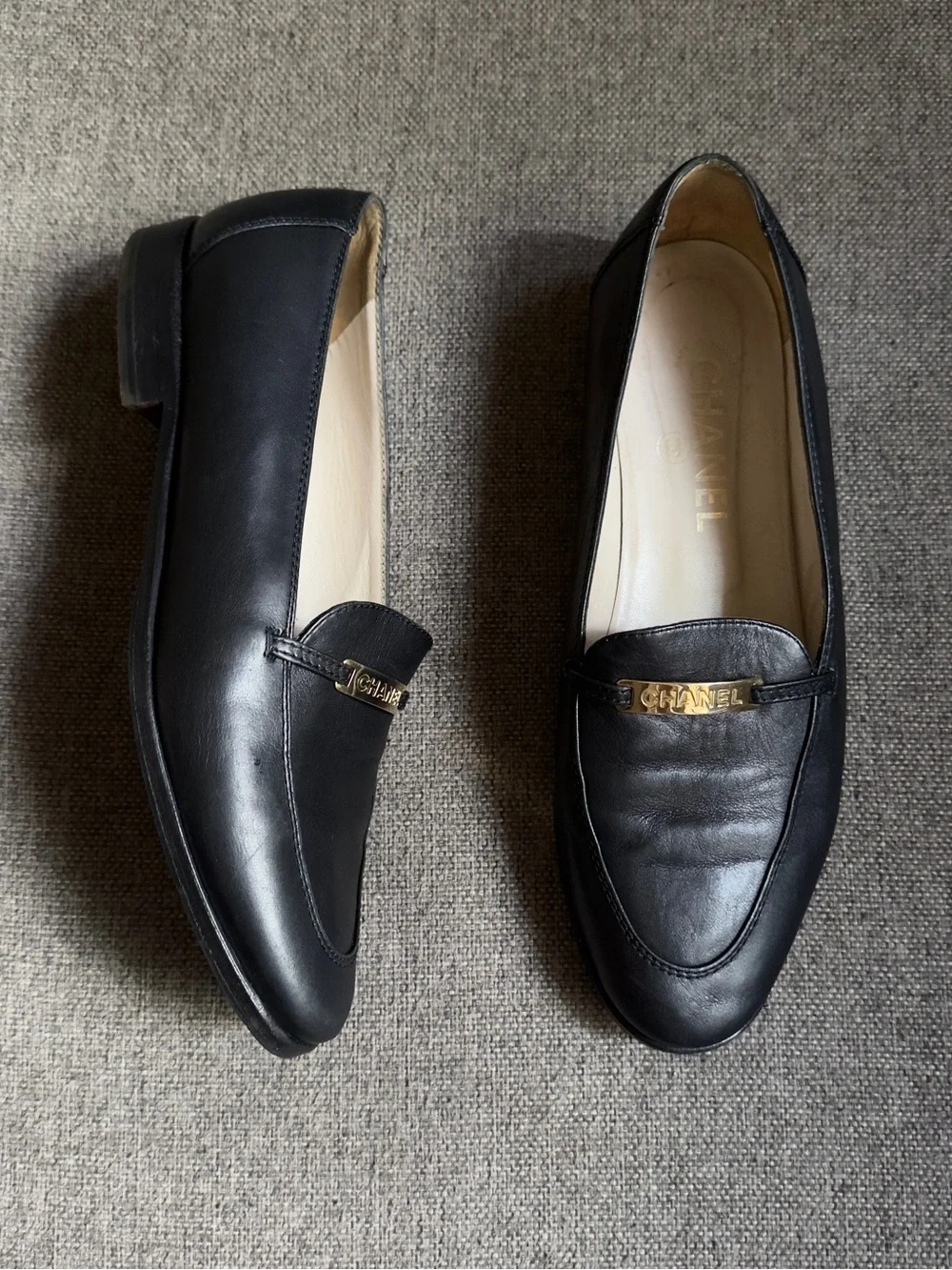 Vintage Chanel black loafers with gold hardware